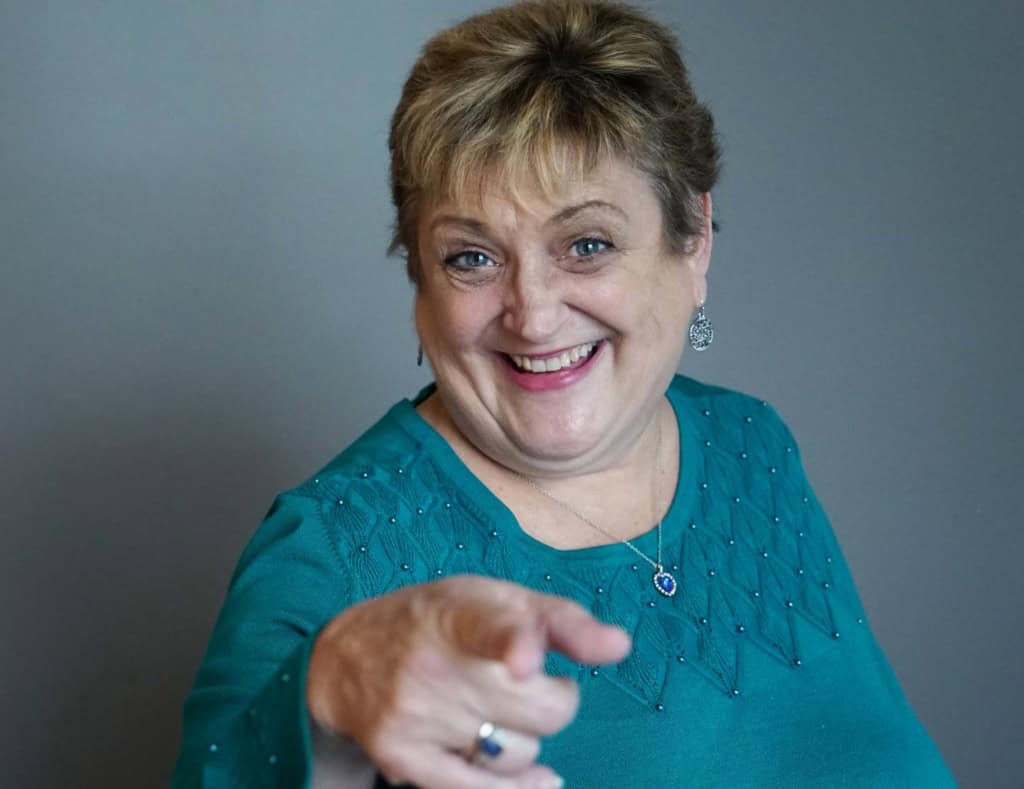 A real estate agent pointing at the camera, on why listings really matter