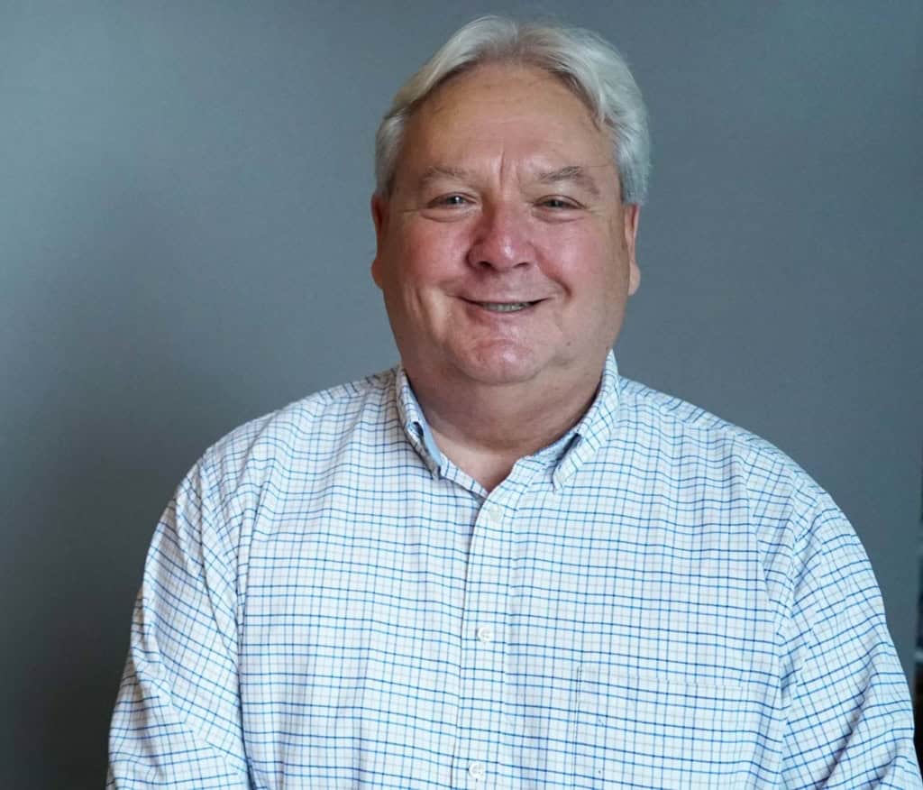A real estate agent speaking to camera, on three fun ways to build your client database
