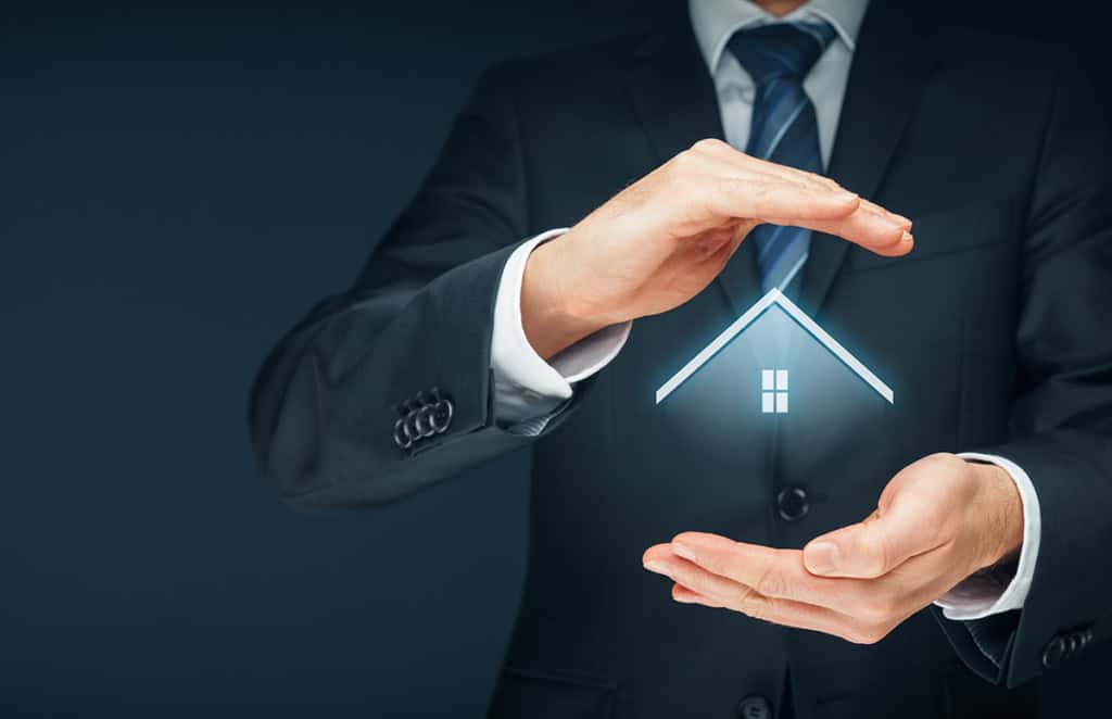 Hands sheltering a glowing house icon, on what a good broker relationship is and what it isn't