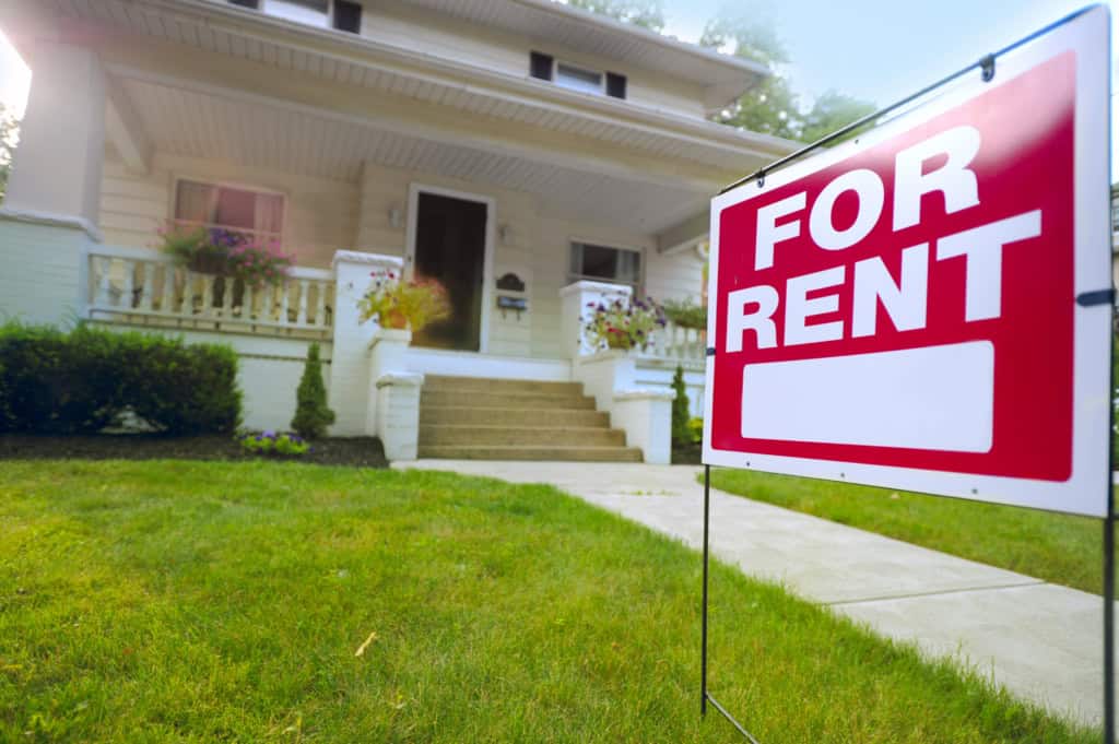 A For Rent sign outside a vacant house, on calculating the cost of a vacant property